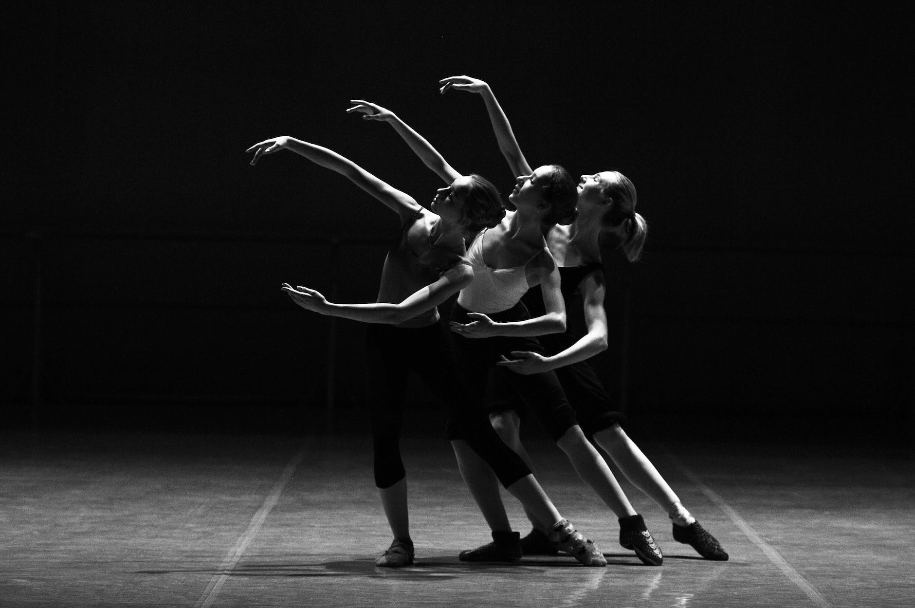 three female dancers dancing